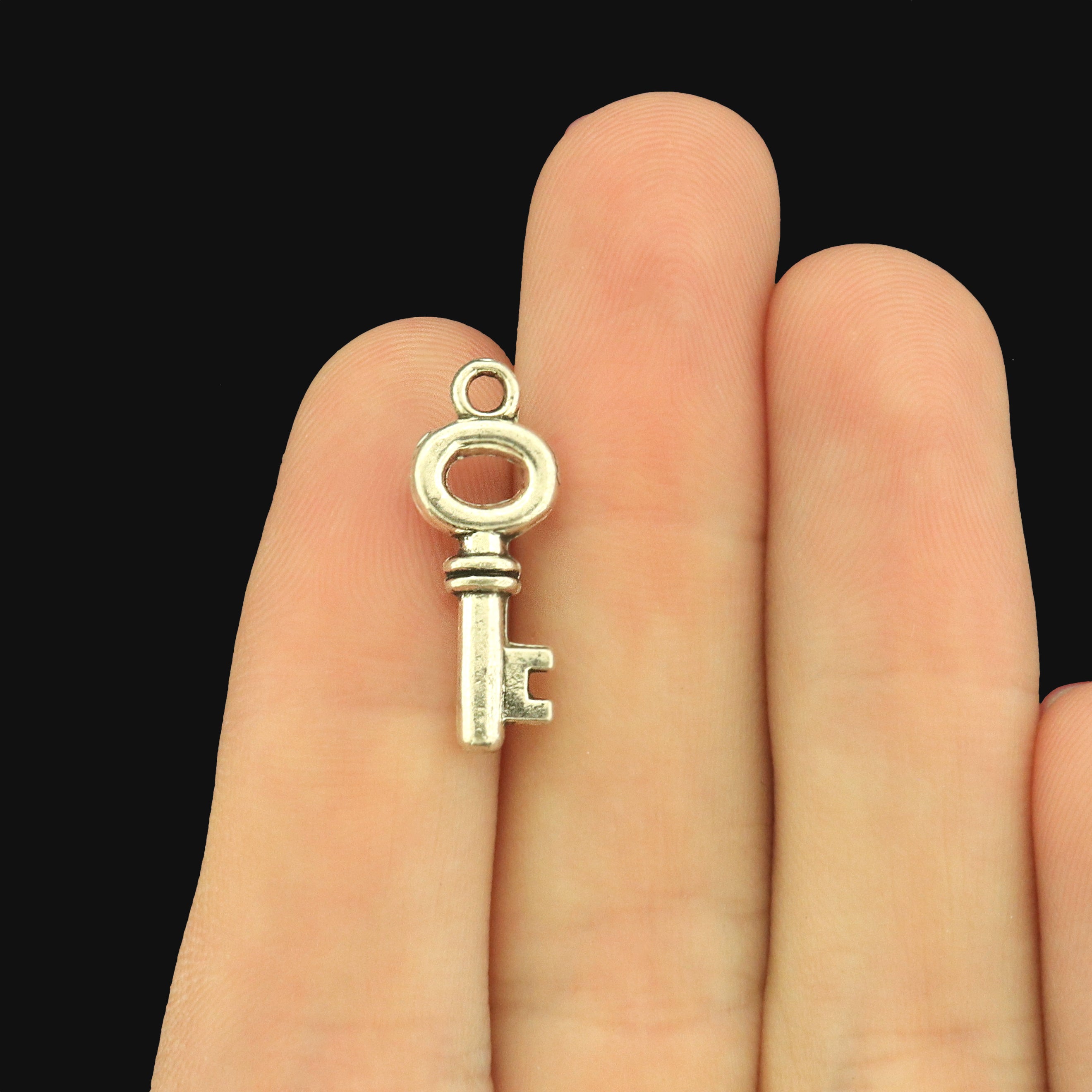 12 Key Antique Silver Tone Charms 2 Sided - SC812