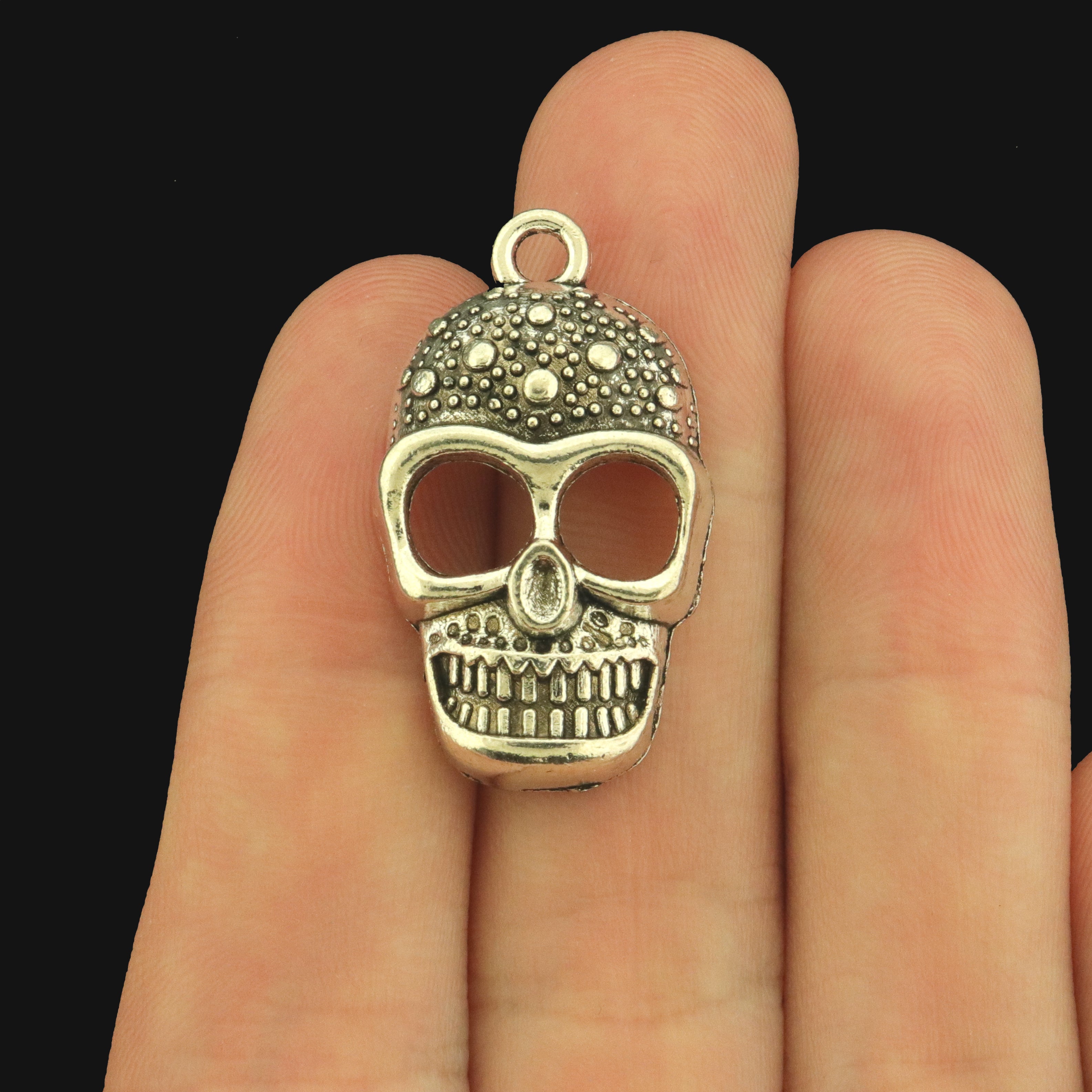 10 Smiling Skull Antique Silver Tone Charms - SC588