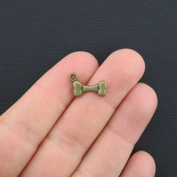 10 Dog Bone Antique Bronze Tone Charms 2 Sided - BC224