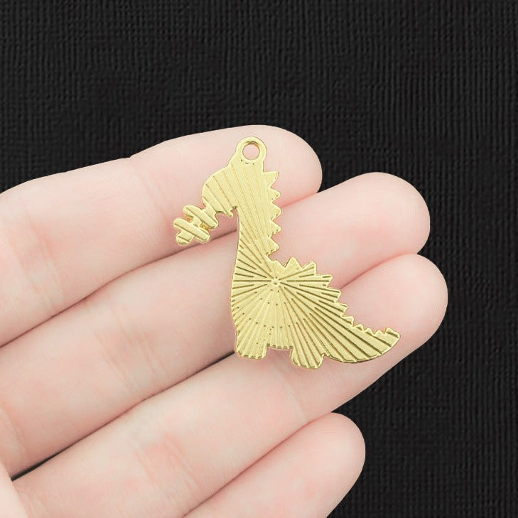 2 breloques dinosaures en émail doré - E779