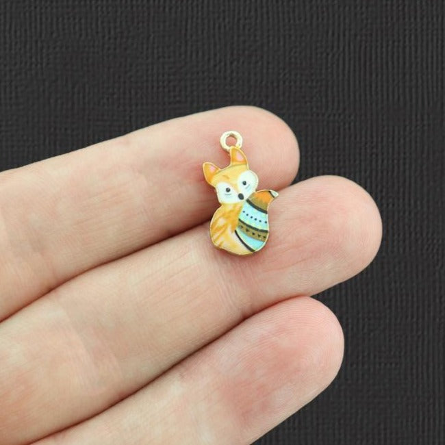 4 breloques en émail doré à rayures bleues - E1031