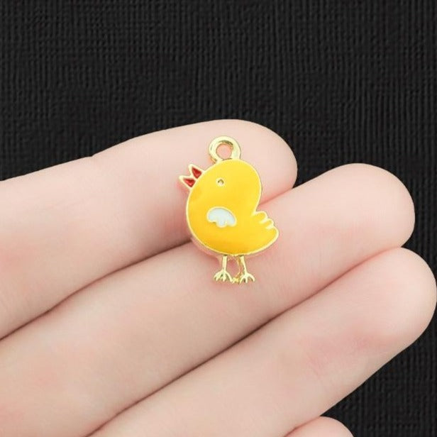 4 breloques en émail doré poussin - E1243