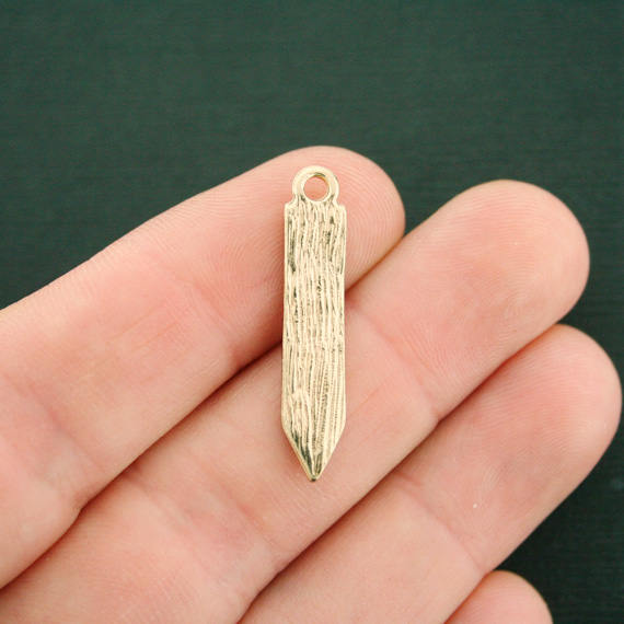 4 breloques en émail doré au crayon - E564