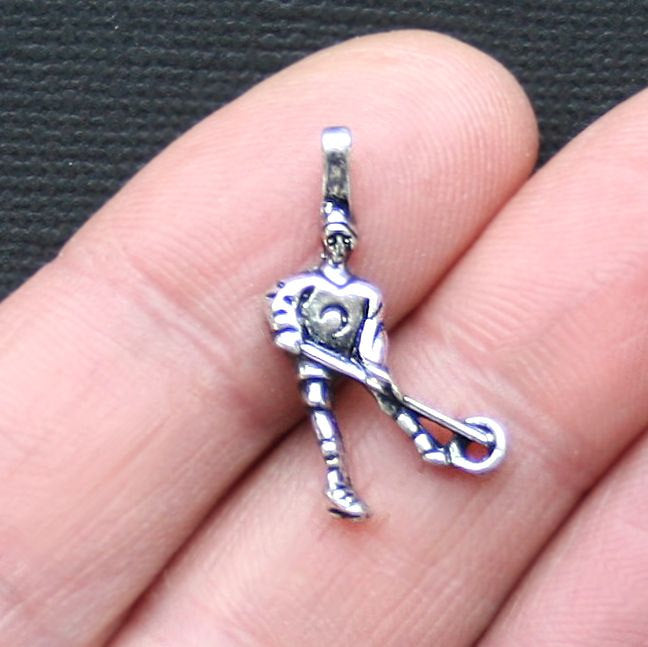 4 Ringette Player Antique Silver Tone Charms - SC3072