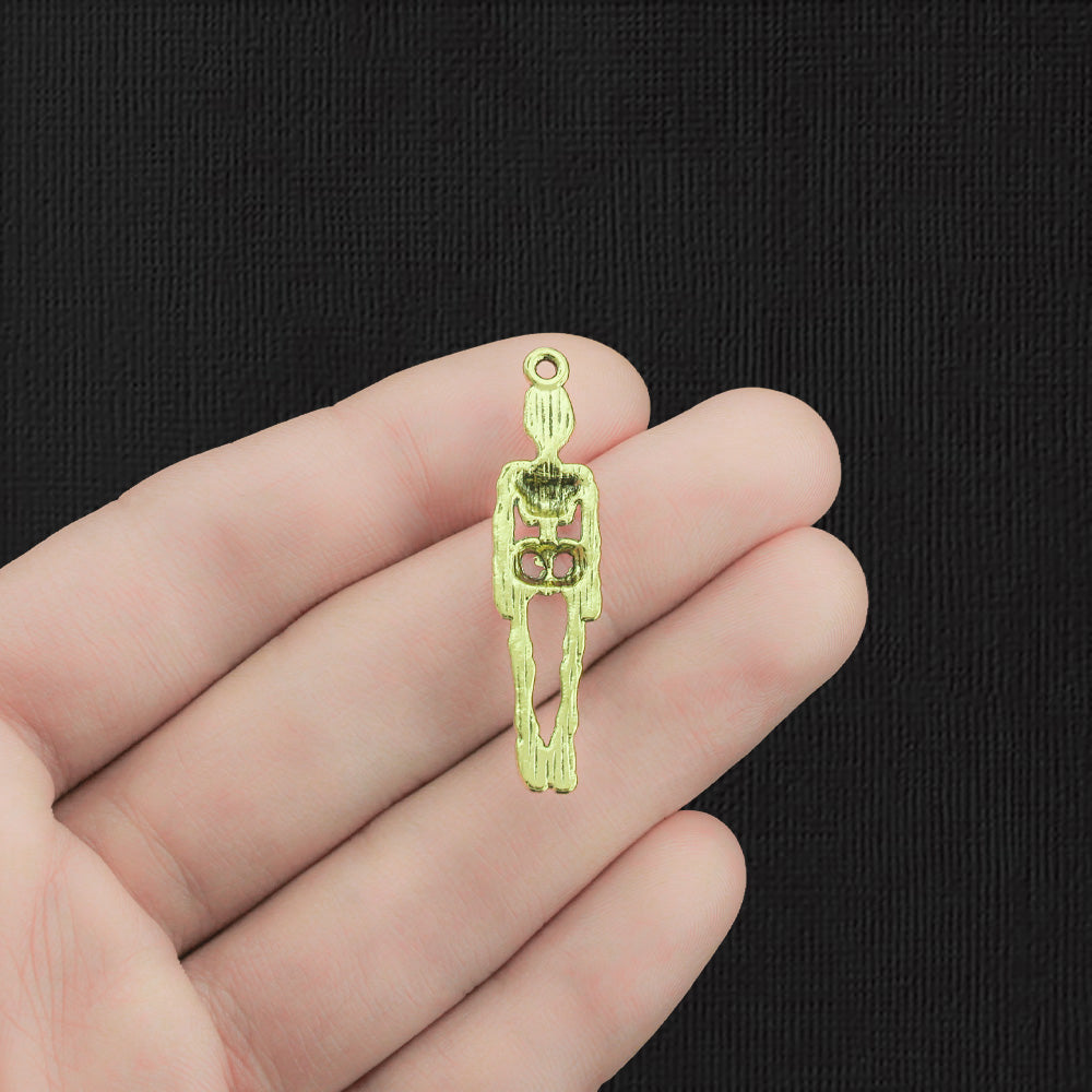 4 Charms Squelette Doré - GC390