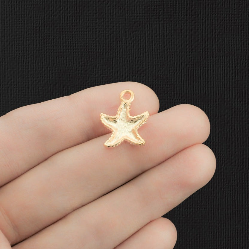 4 breloques en émail doré étoile de mer - E569