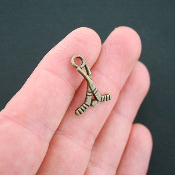 6 Hockey Antique Bronze Tone Charms 2 Sided - BC170