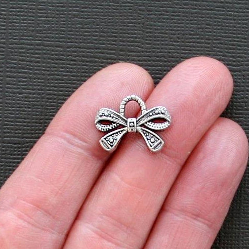 8 Bow Antique Silver Tone Charms - SC1654