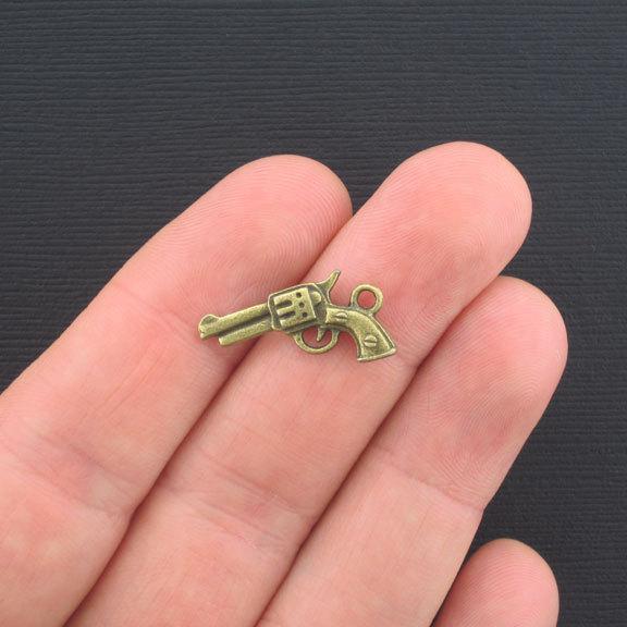 8 Gun Antique Bronze Tone Charms 2 Sided - BC369