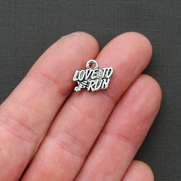 8 breloques en argent antique Love to Run - SC1787