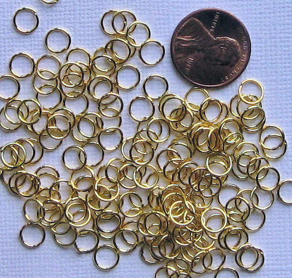 Anneaux dorés 6 mm x 0,9 mm - Calibre 19 ouvert - 1000 anneaux - J037B