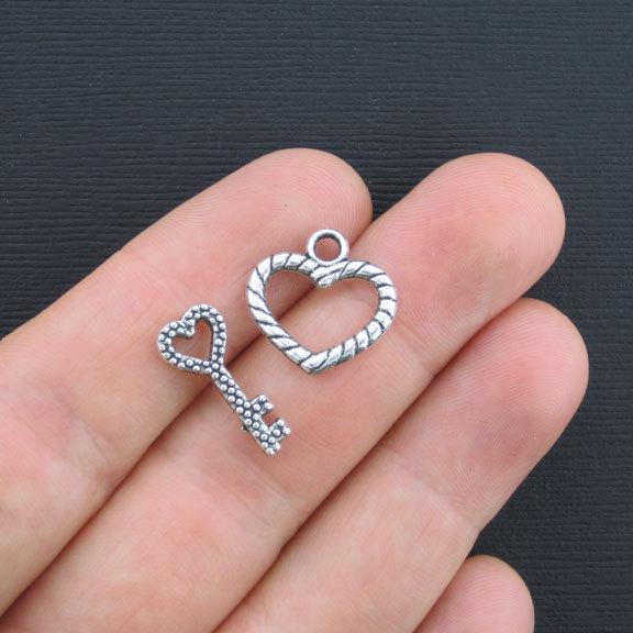 Fermoirs à bascule en forme de cœur argenté 19 mm x 8 mm - 2 jeux de 4 pièces - SC3350