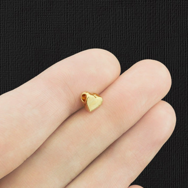 Perles intercalaires coeur 7mm x 6mm - ton or - 50 perles - GC1181