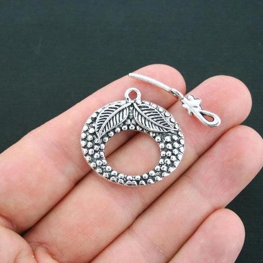 Fermoirs à bascule argentés à feuille 30 mm x 31 mm - 2 jeux de 4 pièces - SC3581