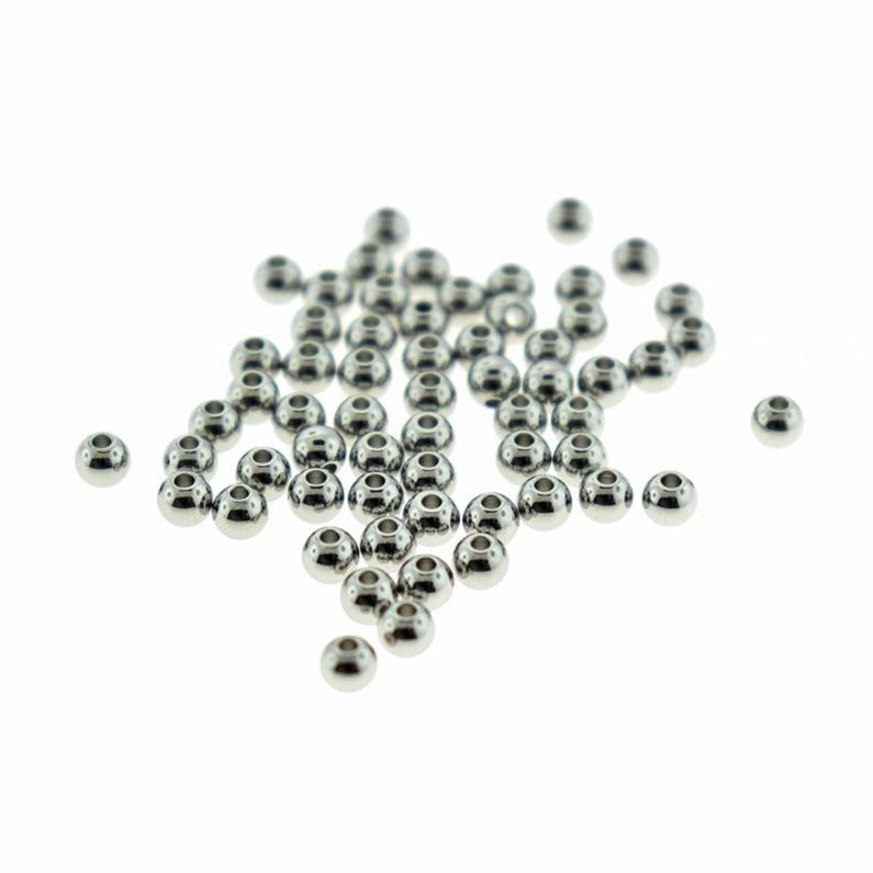 Perles d'espacement rondes en acier inoxydable 4 mm x 4 mm - ton argent - 25 perles - FD819
