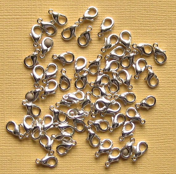 Fermoirs mousqueton argentés 12 mm x 6 mm - 50 fermoirs - FF208