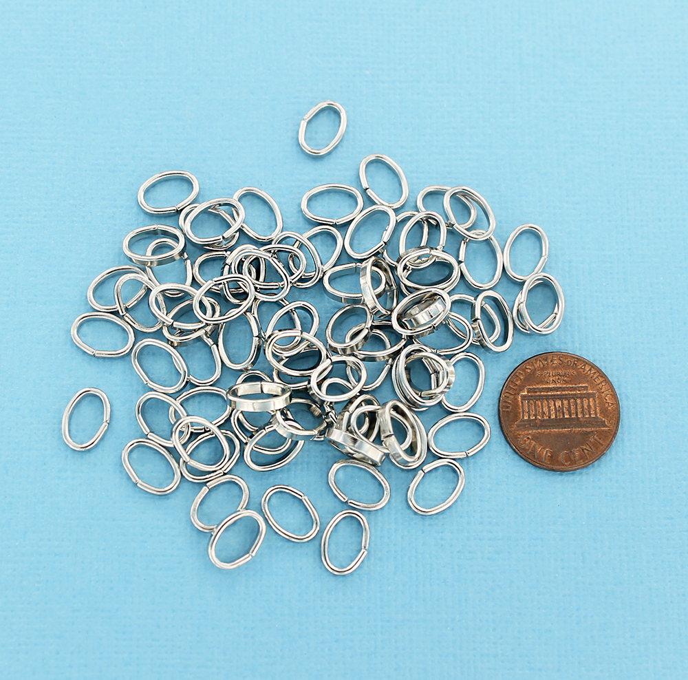 Anneaux ovales argentés 10 mm x 7 mm, 2 mm x 1 mm - Calibre ouvert 12 x 18 - 100 anneaux - J080