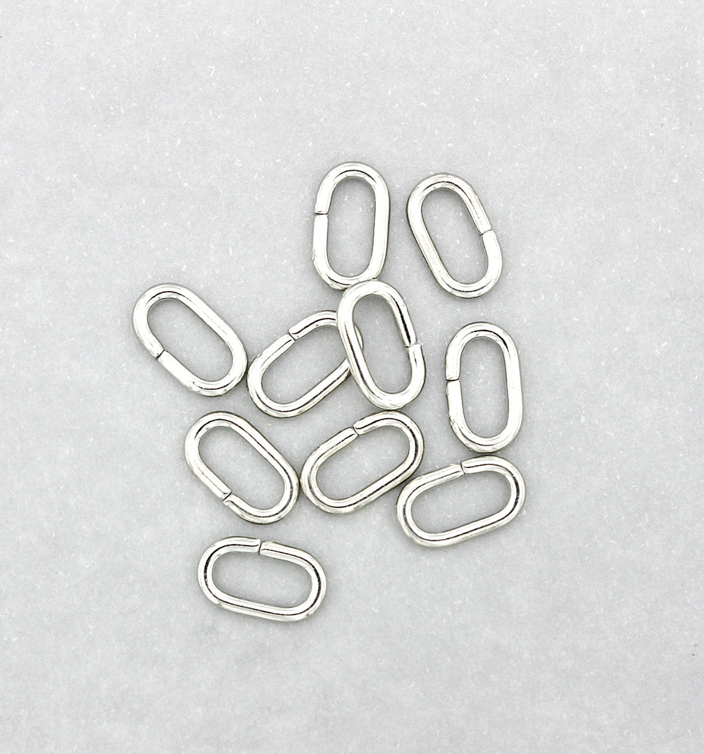 Anneaux ovales argentés 11 mm x 6 mm x 1,5 mm - Calibre 15 ouvert - 50 anneaux - J189