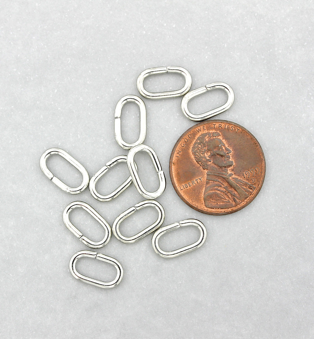 Anneaux ovales argentés 11 mm x 6 mm x 1,5 mm - Calibre 15 ouvert - 50 anneaux - J189