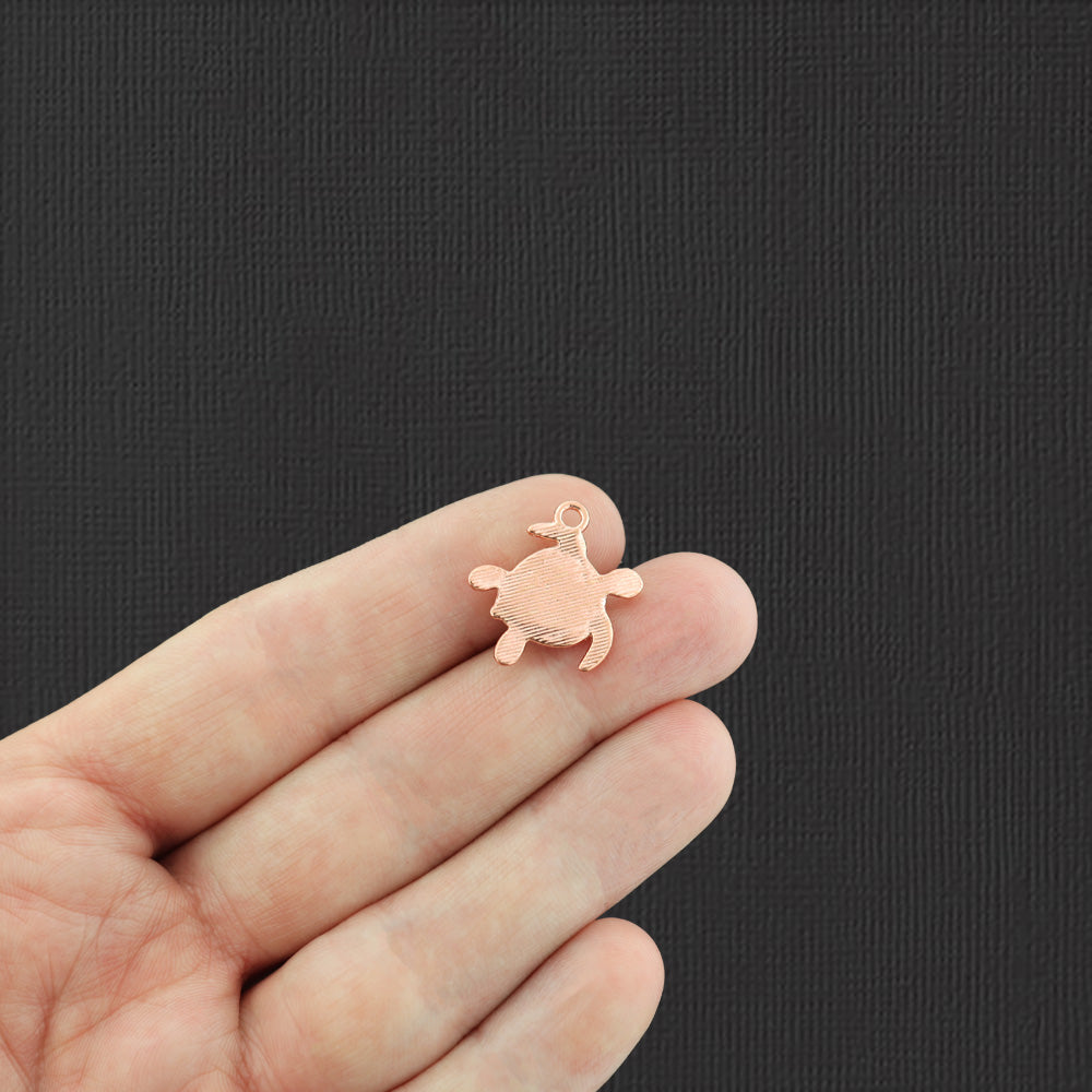 Charm tortue ton or rose avec verre de mer rose incrusté - GC247