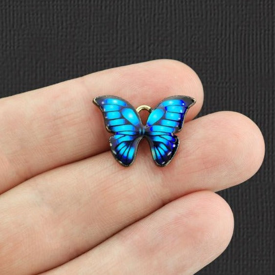 5 breloques en émail doré papillon violet - E1079