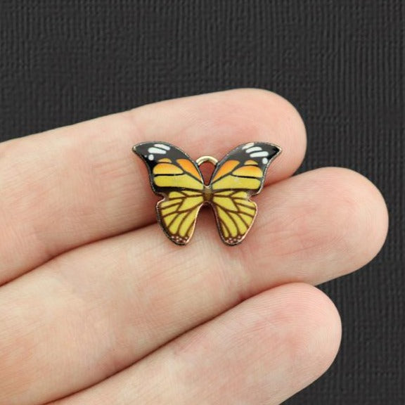 5 breloques en émail doré papillon violet - E1079