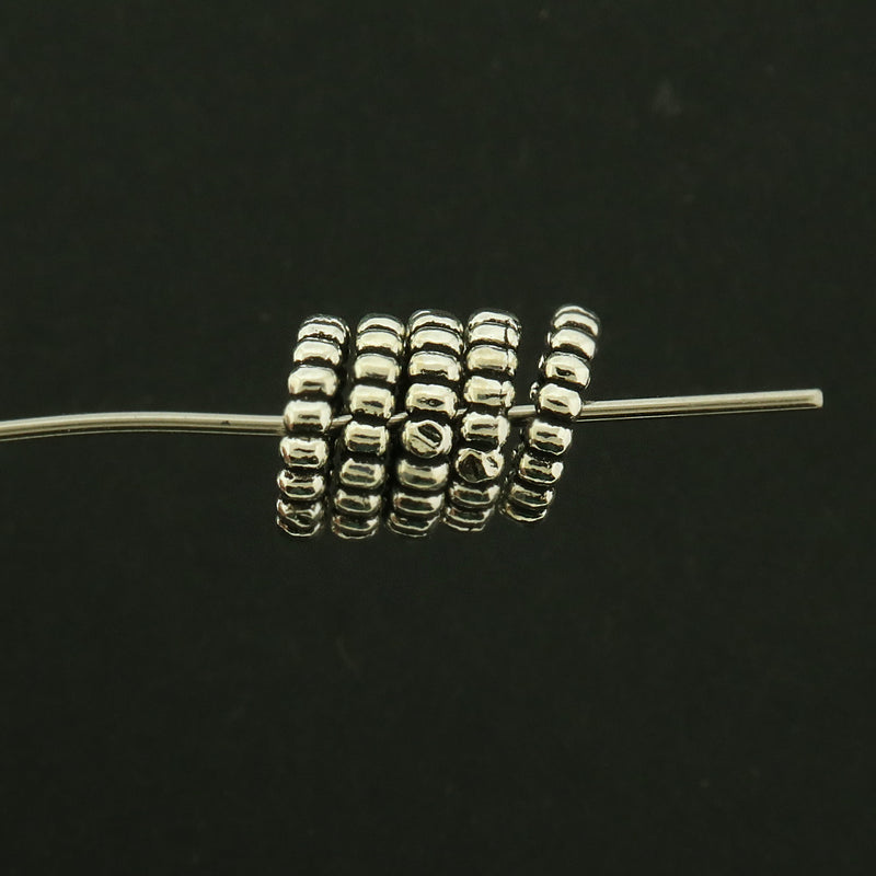 Perle d'espacement hexagonale en acier inoxydable 11 mm x 10 mm - ton argent - 1 perle - FD589