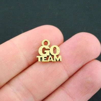 10 Go Team Antique Gold Tone Charms - GC147