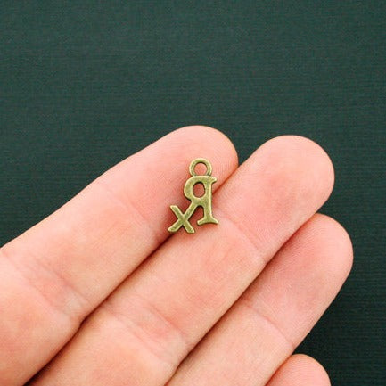 10 RX Antique Bronze Tone Charms - BC935