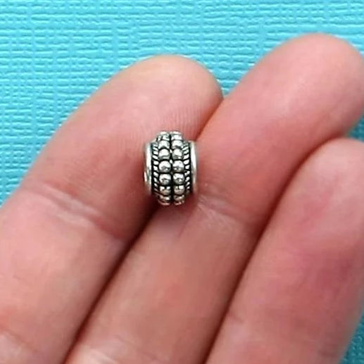 Perles intercalaires ovales 9 mm x 7 mm - ton argent - 10 perles - SC135