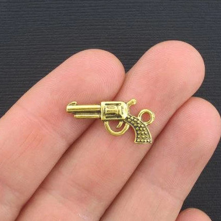 10 Gun Antique Gold Tone Charms 2 Sided - GC253
