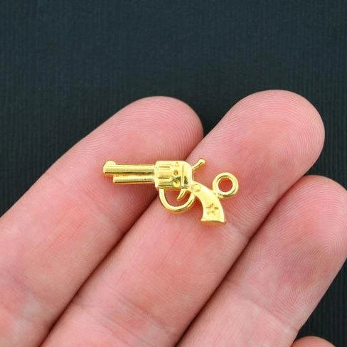 10 Gun Antique Gold Tone Charms 2 Sided - GC298
