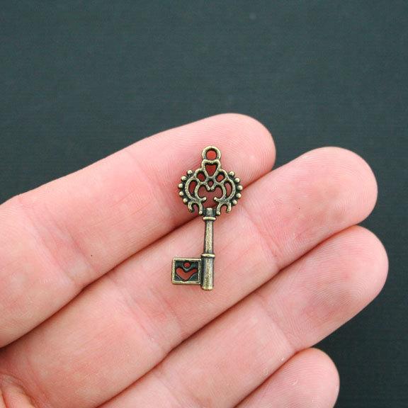 10 Key Antique Bronze Tone Charms 2 Sided - BC450