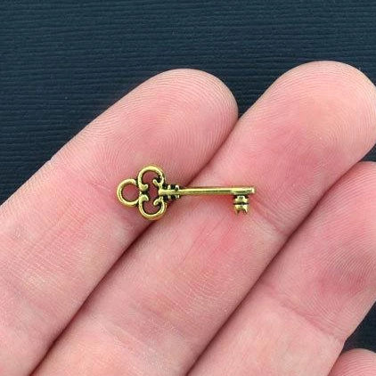 10 Key Antique Gold Tone Charms 2 Sided - GC269