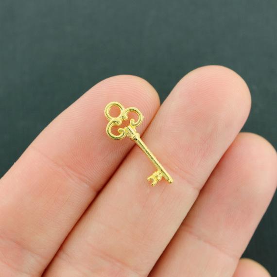 10 Key Gold Tone Charms 2 Sided - GC1278