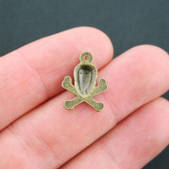 10 breloques tête de mort et os croisés en bronze antique - BC1217