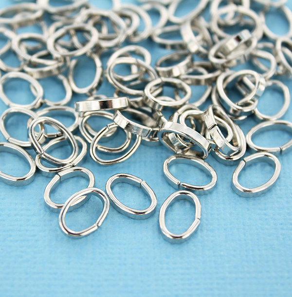 Anneaux ovales argentés 10 mm x 7 mm, 2 mm x 1 mm - Calibre ouvert 12 x 18 - 100 anneaux - J080