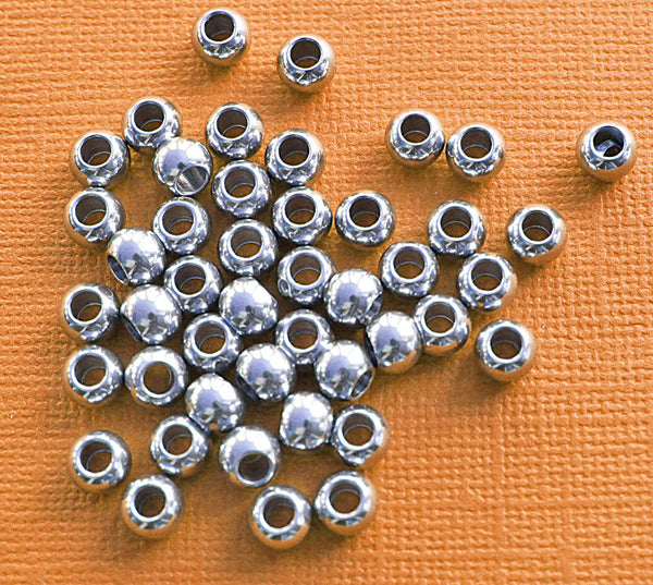 Perles d'espacement rondes 6mm x 6mm - ton argent - 35 perles - FD099