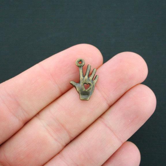 12 Hand Antique Bronze Tone Charms 2 Sided - BC815