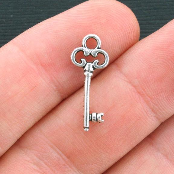 12 Key Antique Silver Tone Charms 2 Sided - SC4220