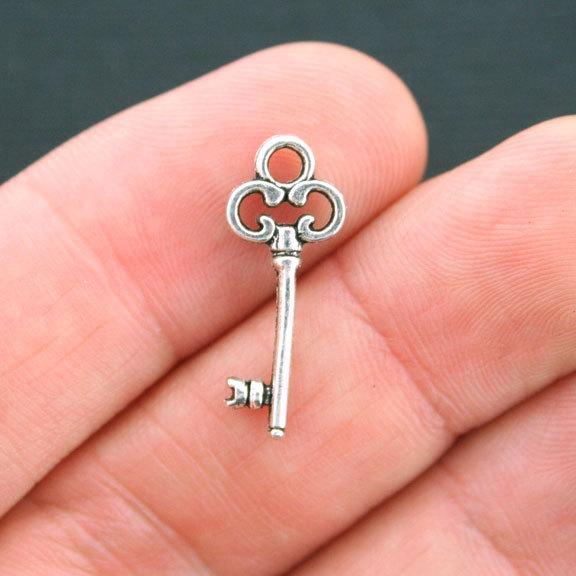 12 Key Antique Silver Tone Charms 2 Sided - SC4220