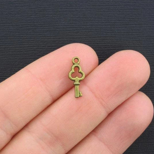 15 Key Antique Bronze Tone Charms 2 Sided - BC204