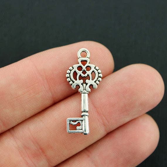 8 Key Antique Silver Tone Charms 2 Sided - SC1726