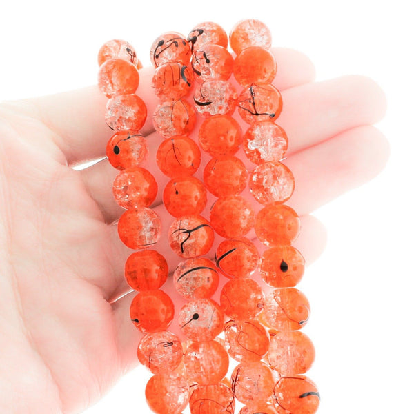 Round Glass Beads 10mm - Clear and Orange with Black - 1 Strand 84 Beads - BD601