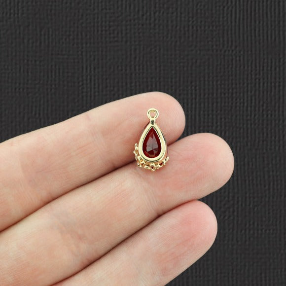 2 pendentifs en verre rouge dorés - Z251