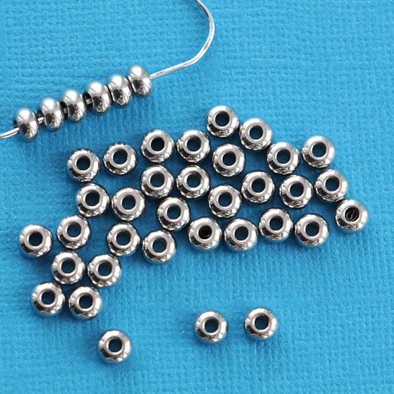 Perles Intercalaires Rondes 5mm x 3mm - Acier Inoxydable Argenté - 20 Perles - FD217