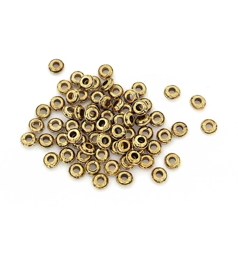 Perles intercalaires rondes 5,5 mm x 2,5 mm - ton or - 25 perles - GC1045
