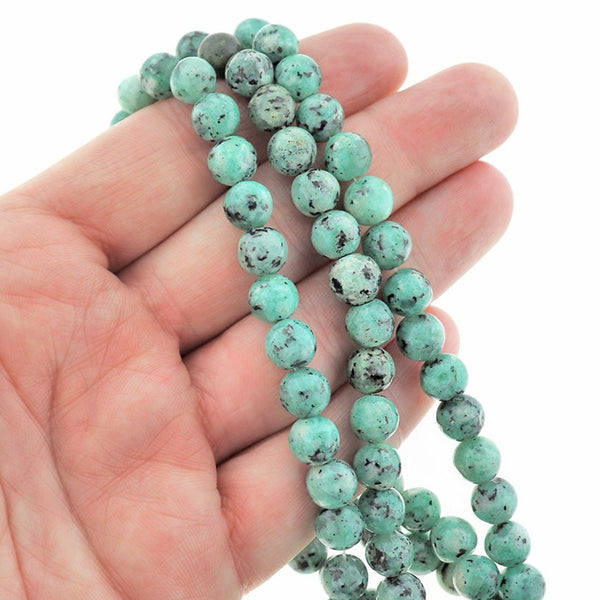 Perles rondes imitation pierres précieuses 8 mm - Bleu sarcelle avec des taches noires - 1 brin 50 perles - BD2273