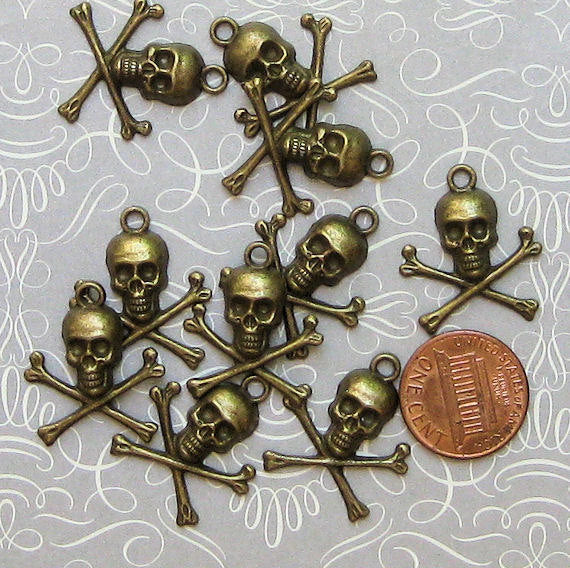 6 Skull Antique Bronze Tone Charms - BC272