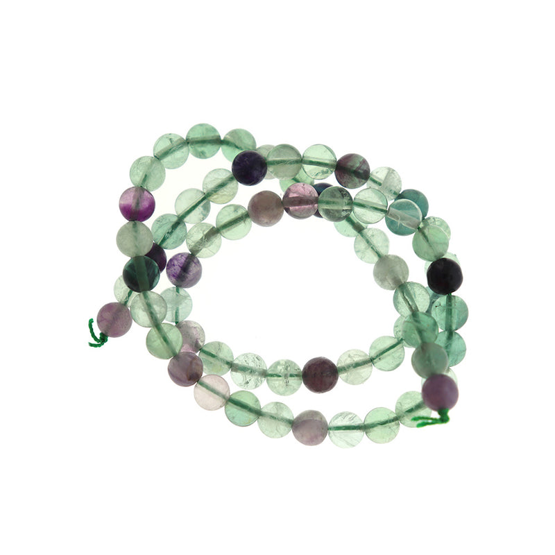 Perles rondes en fluorite naturelle 6 mm - violets, bleus et verts - 1 brin 61 perles - BD1665